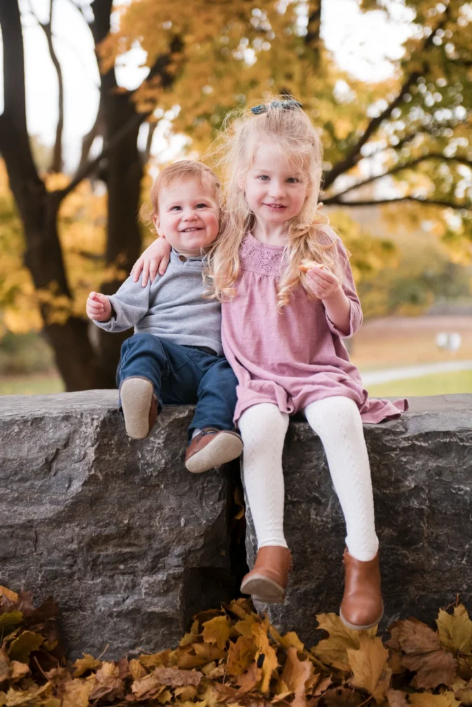 a family portrait of a little girl sitting with her baby brother -shot at dundurn castle in hamilton ontario