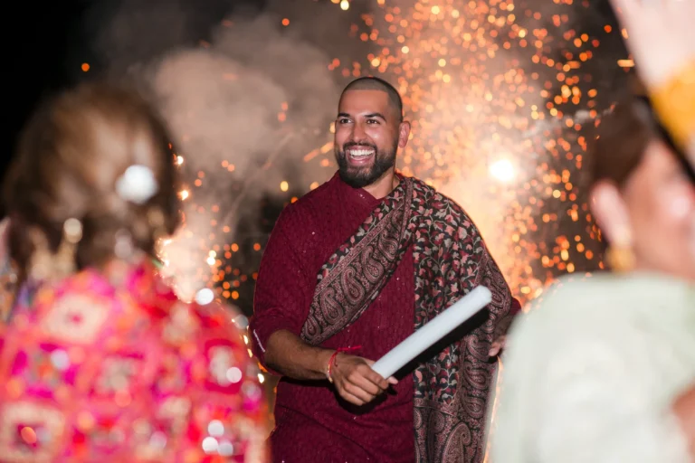 Fireworks go off behind a groom during his Jago ceremony in Burlington. Shot by Pixelesque Photography - Hamilton Wedding Photographer.