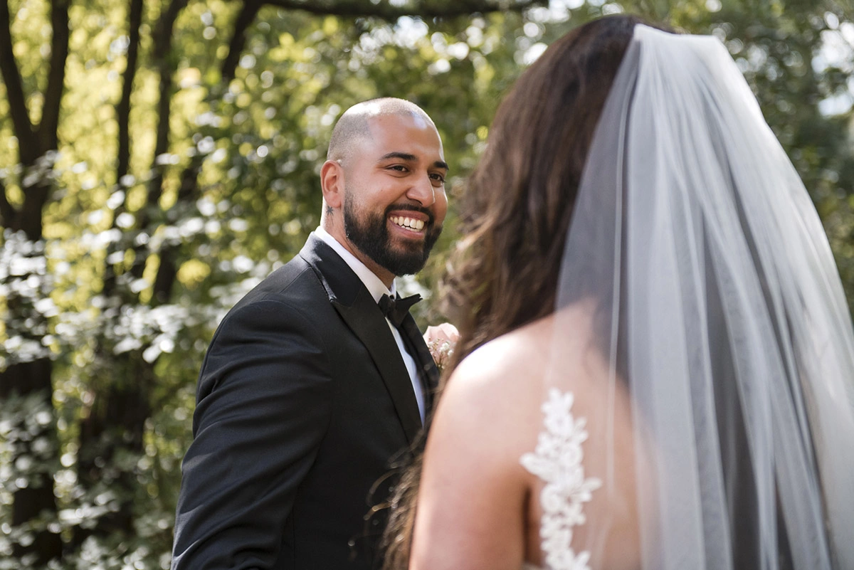 a groom reacts to seeing his bride for the first time. Shot by Pixelesque Photography - Hamilton Wedding Photographer.