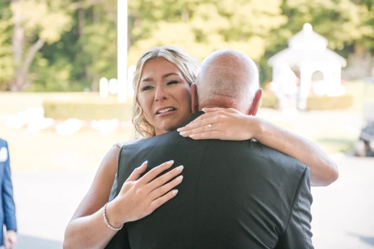 A bride breaks down in tears while hugging her father. Shot at CopeTown Woods Golf Club by Pixelesque Photography - Hamilton Wedding Photographer.