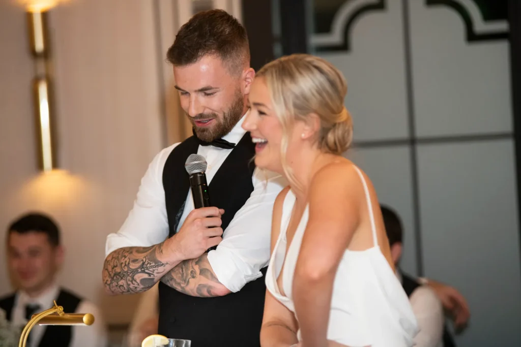 After the Rains : Kayla & Kyle's Whistle Bear Golf Club Wedding 34 The groom shares his speech as the bride laughs in front of him. Shot at Whistle Bear Golf Club by Pixelesque Photography - Hamilton Wedding Photographer.