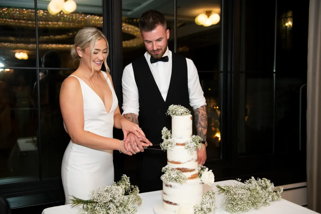 After the Rains : Kayla & Kyle's Whistle Bear Golf Club Wedding 35 The couple cut their cake. Shot at Whistle Bear Golf Club by Pixelesque Photography - Hamilton Wedding Photographer.