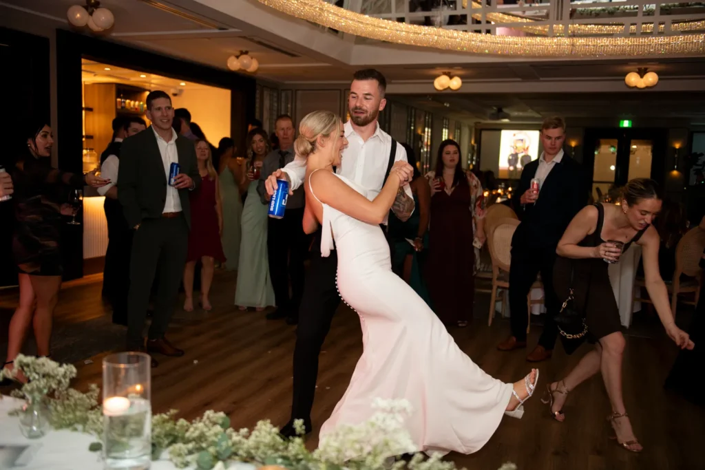 After the Rains : Kayla & Kyle's Whistle Bear Golf Club Wedding 38 The wedding couple dances on the dance floor amongst the guests. Shot at Whistle Bear Golf Club by Pixelesque Photography - Hamilton Wedding Photographer.