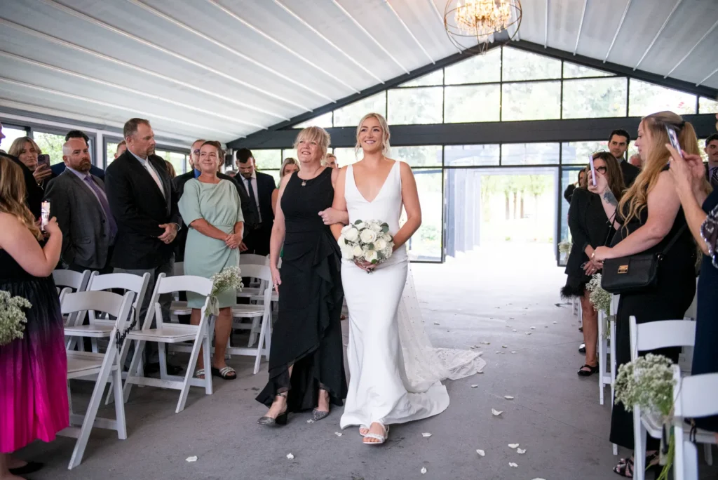 After the Rains : Kayla & Kyle's Whistle Bear Golf Club Wedding 9 the bride walks up the aisle to be married. Shot at Whistle Bear Golf Club by Pixelesque Photography - Hamilton Wedding Photographer.