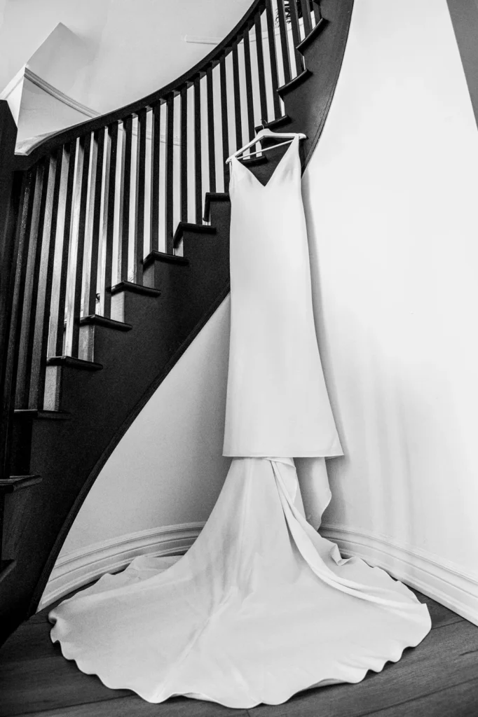 the wedding dress sprawled out off a cascading staircase. Shot at Whistle Bear Golf Club by Pixelesque Photography - Hamilton Wedding Photographer.