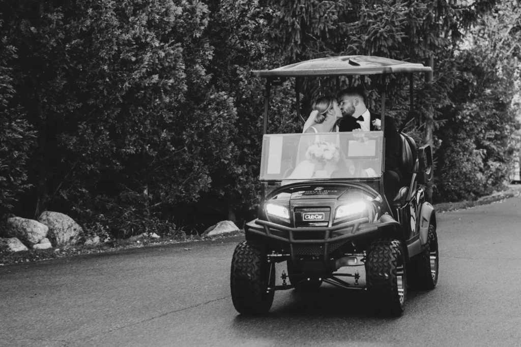 After the Rains : Kayla & Kyle's Whistle Bear Golf Club Wedding 14 the wedding couple share a kiss in a gold cart. Shot at Whistle Bear Golf Club by Pixelesque Photography - Hamilton Wedding Photographer.