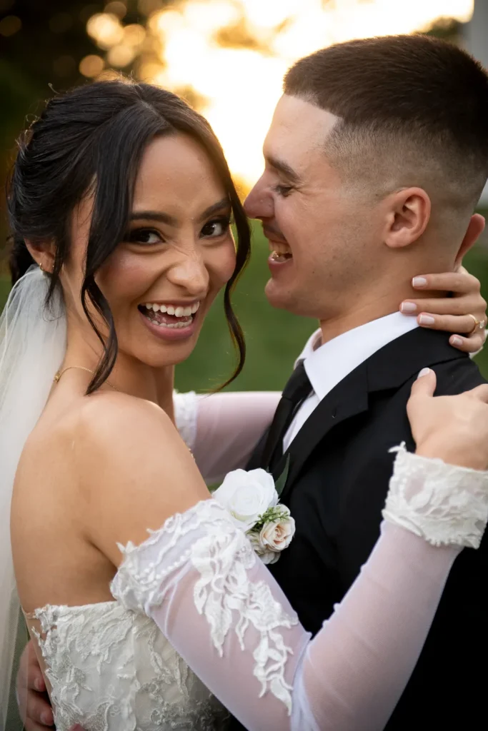 the couple share a laugh. One of many beautiful moments from a wedding at Harding Waterfront Estate in Oakville, by Pixelesque Photography - Hamilton Wedding Photographer.