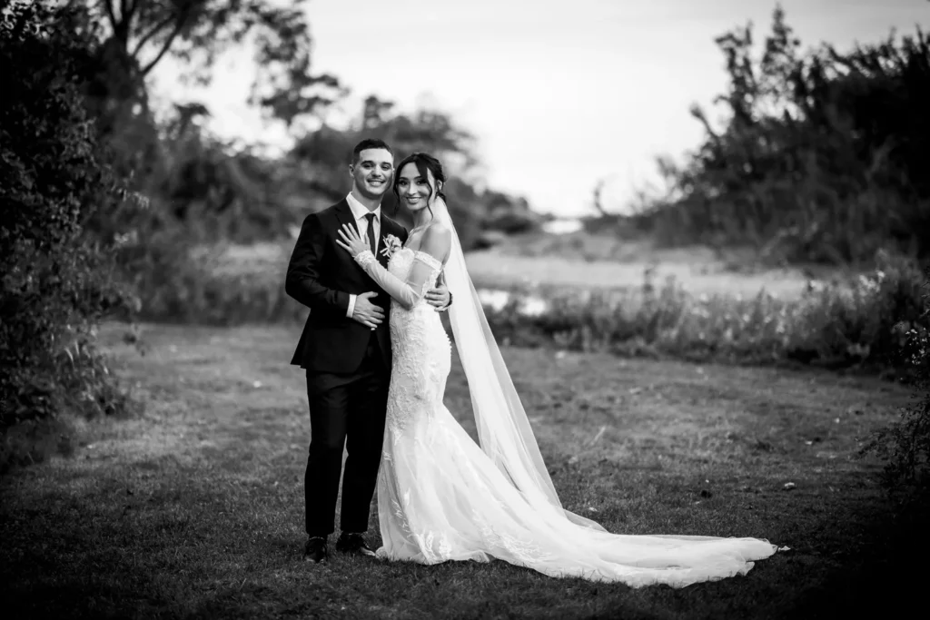 the couple share a moment. One of many beautiful moments from a wedding at Harding Waterfront Estate in Oakville, by Pixelesque Photography - Hamilton Wedding Photographer.