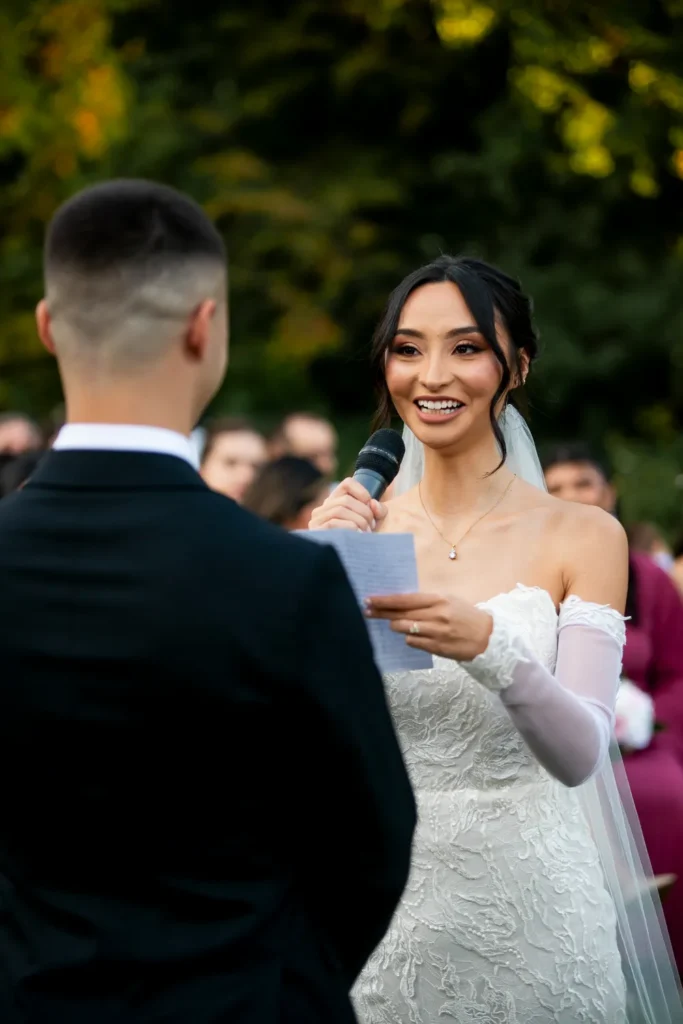 the bride reads her vows to her groom. One of many beautiful moments from a wedding at Harding Waterfront Estate in Oakville, by Pixelesque Photography - Hamilton Wedding Photographer.