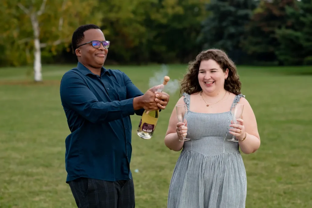 Champagne popping after a proposal photos at Konzelmann Estate in Niagara-on-the-Lake