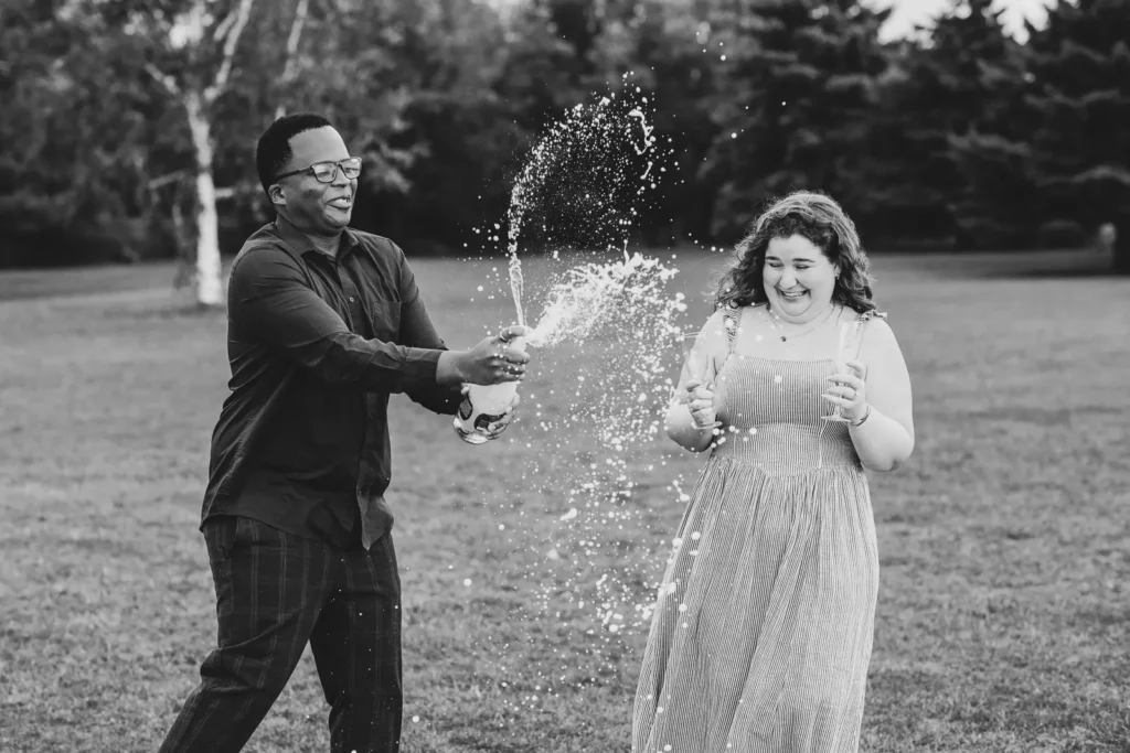 Champagne popping after a proposal photos at Konzelmann Estate in Niagara-on-the-Lake