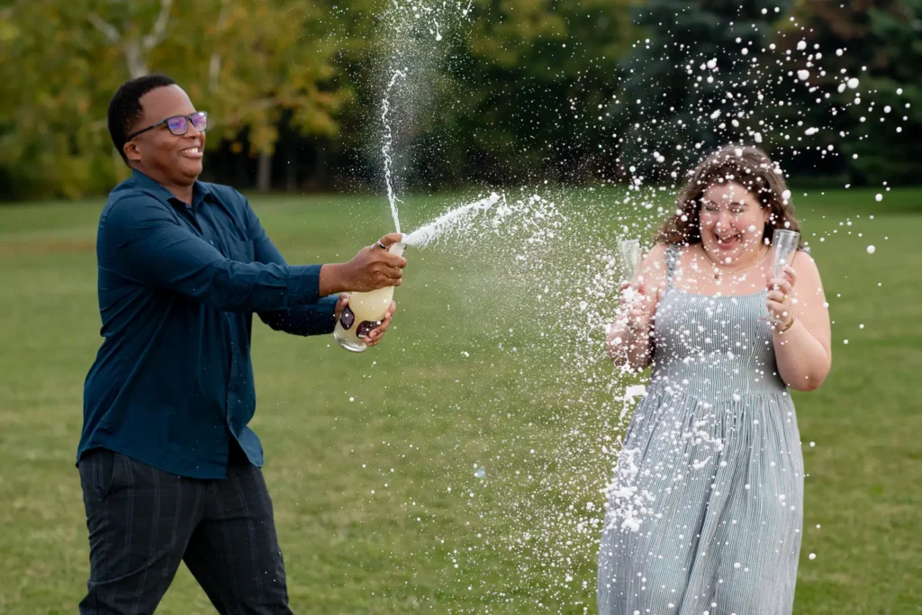 Champagne popping after a proposal photos at Konzelmann Estate in Niagara-on-the-Lake