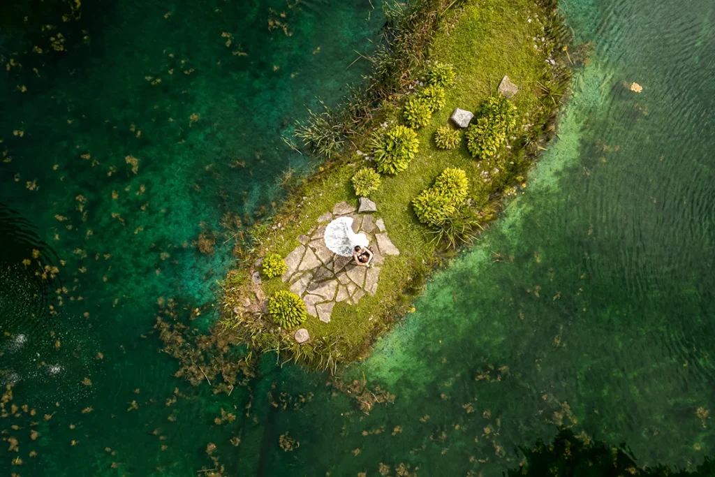 A couple framed beautifully from above by the colours and textures of Trillium Trails Event Centre. A wedding day drone photograph shot by Pixelesque Photography - Hamilton wedding Photographer.