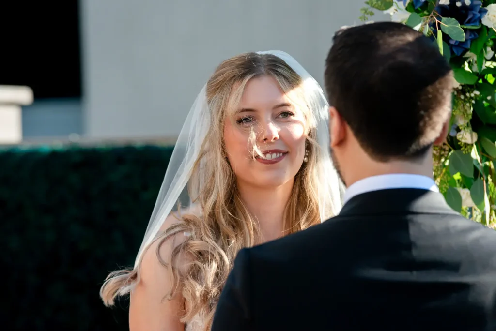 the bride looks lovingly at her groom. Shot at Carmen's event centre, Hamilton by Pixelesque Photography.