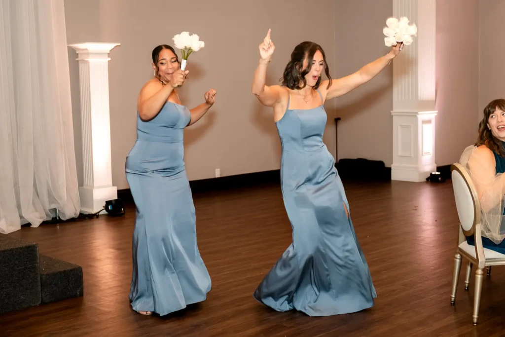 the bridesmaids dance as they enter the reception. Shot at Carmen's Event Centre, Hamilton by Pixelesque Photography.