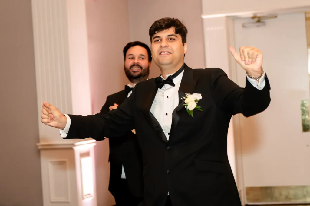 The groomsmen dance their way into the reception. Shot at Carmen's Event Centre, Hamilton by Pixelesque Photography.