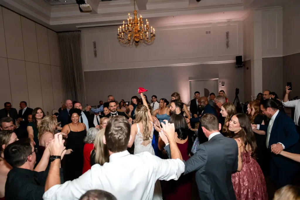 a wedding dance floor fills with people doing a traditional turkish dance. Shot at Carmen's Event Centre, Hamilton by Pixelesque Photography.