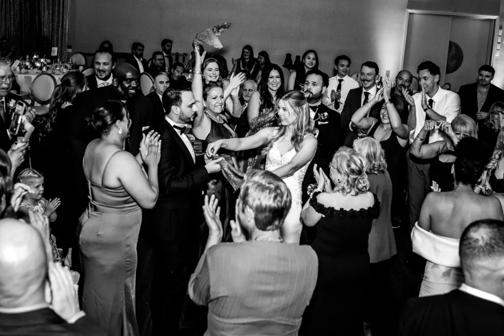 a wedding dance floor fills with people doing a traditional turkish dance. Shot at Carmen's Event Centre, Hamilton by Pixelesque Photography.