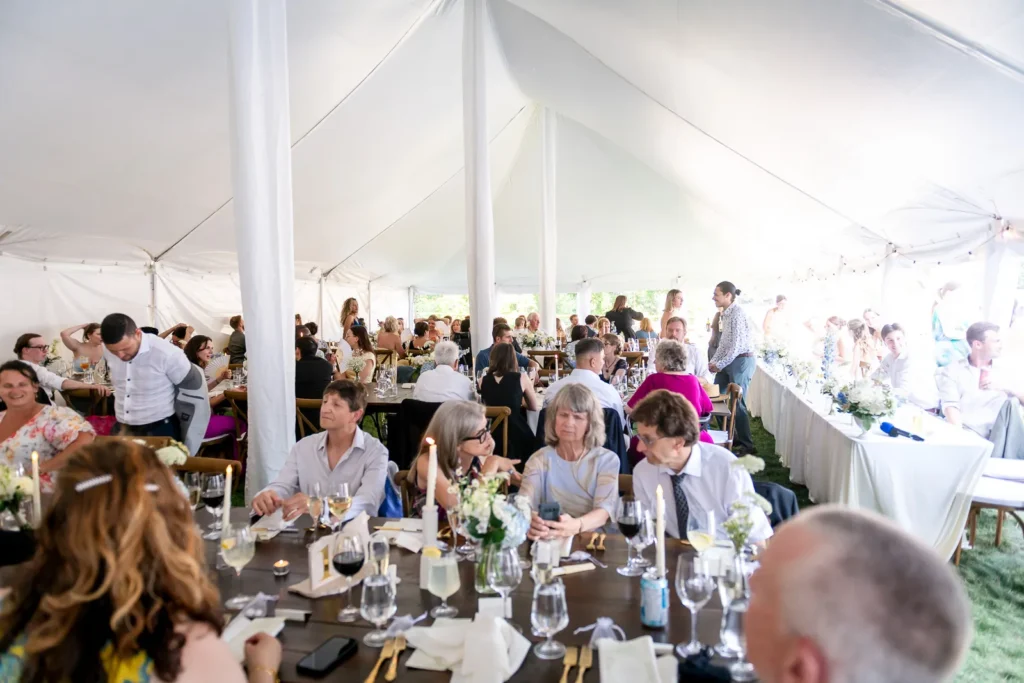 Wedding tent setup with elegant table décor for the backyard reception.