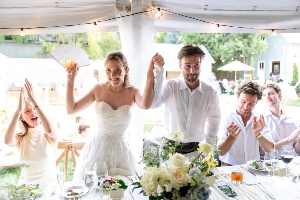 Bride and groom welcome during the tented reception in Picton.