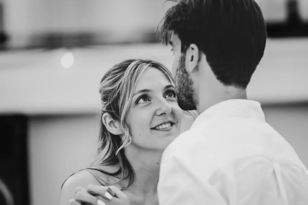 Bride looking lovingly at the groom during their first dance.