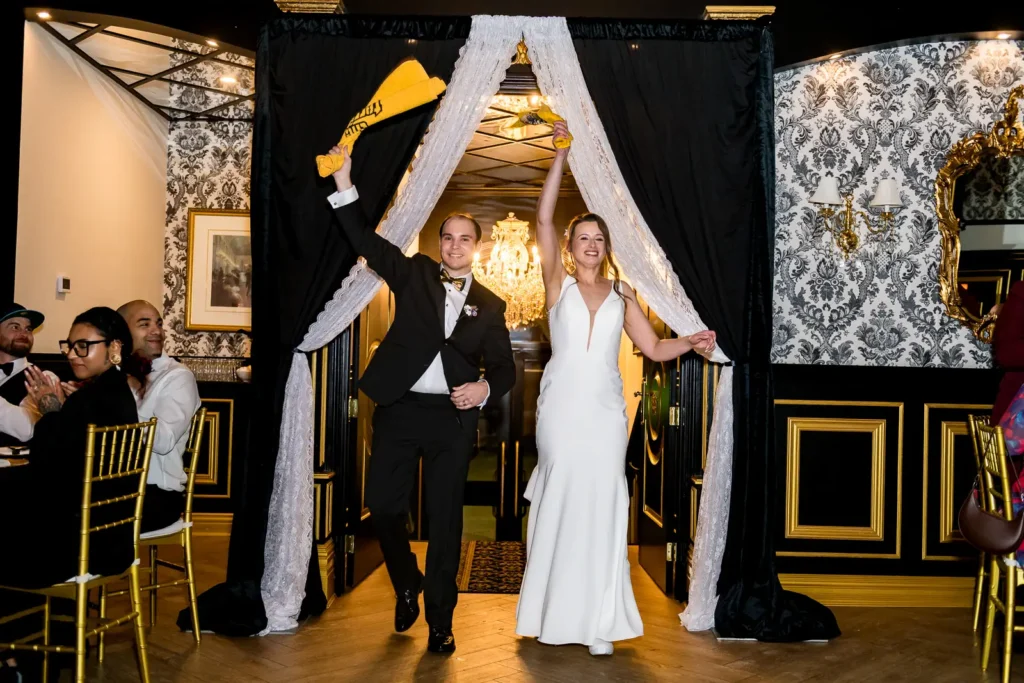 Wedding couple grand entrance waving towels reception