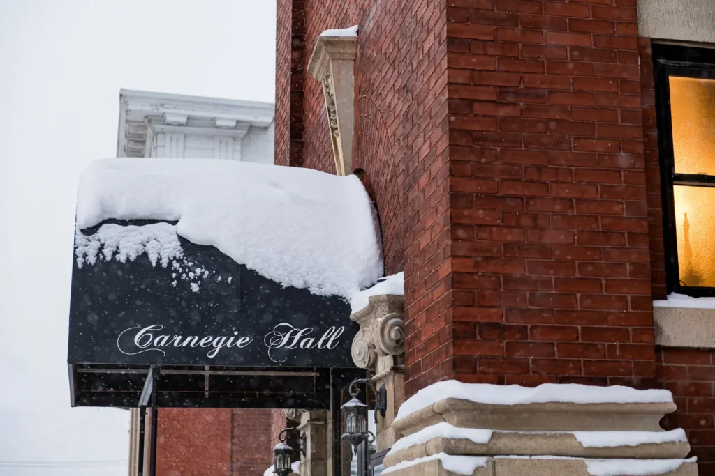 Snow falling outside Belle Vie Ingersoll wedding venue entrance