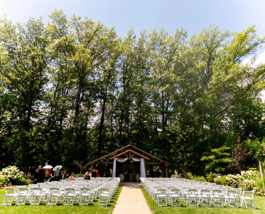 the tree line towers over the wedding ceremony site at Club Roma in St. Catharines Niagara.