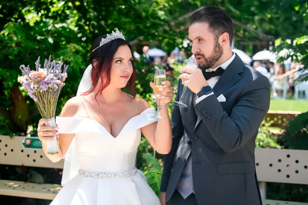 the newlywed couple toast their drinks at Club Roma in St. Catharines Niagara.