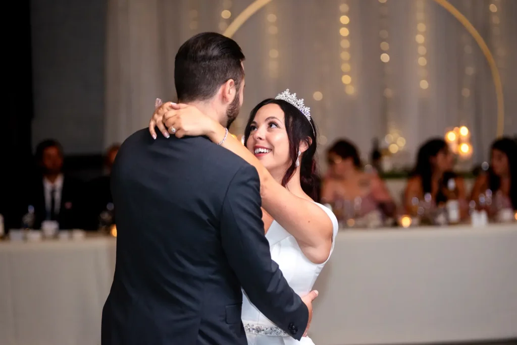 the bride and groom share their first dance at the Gemini Room at Club Roma in St. Catharines Niagara.