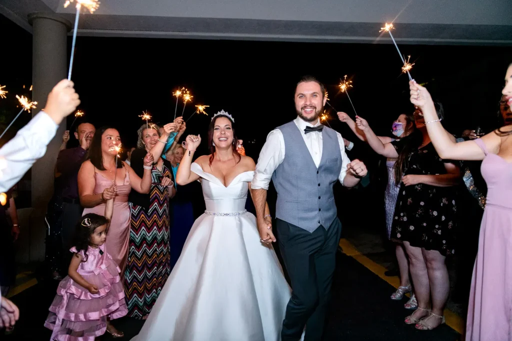 the couple begin their way through a sparkler exit at Club Roma in St. Catharines Niagara.