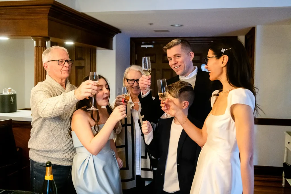 "cocktail hour" toast after a hotel room elopement in niagara-on-the-lake