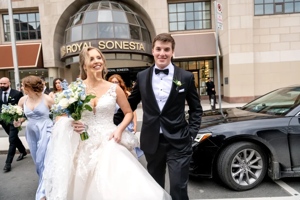 Bridal party crossing road outside Royal Sonesta Yorkville, Toronto
