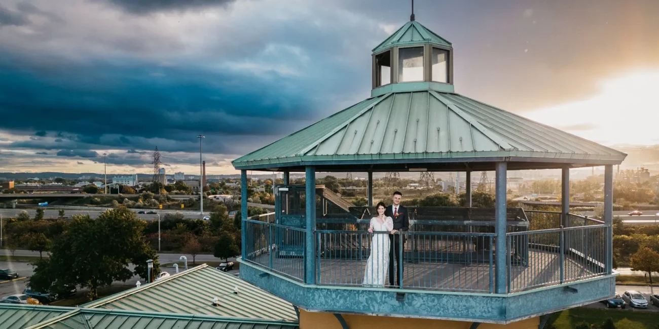 a dramatic sky behind the lighthouse at The Lakeview by Carmen's in Hamilton.