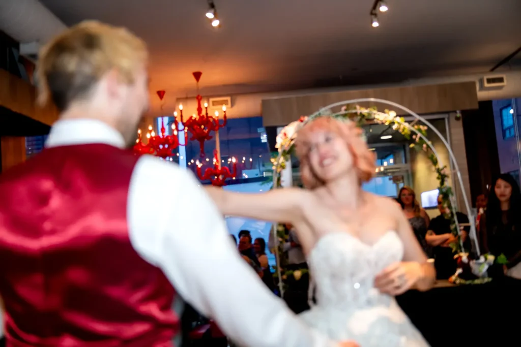 the couple have their first dance at il ponte cucina italiana in downtown toronto.